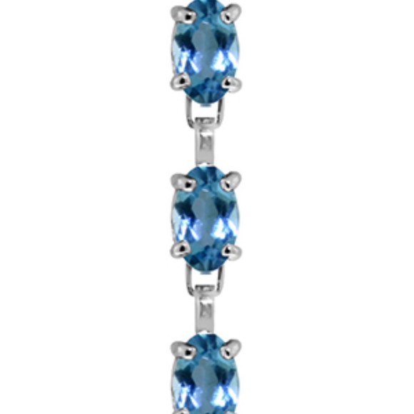 14K. SOLID GOLD TENNIS BRACELET WITH BLUE TOPAZ - Picture 2 of 2